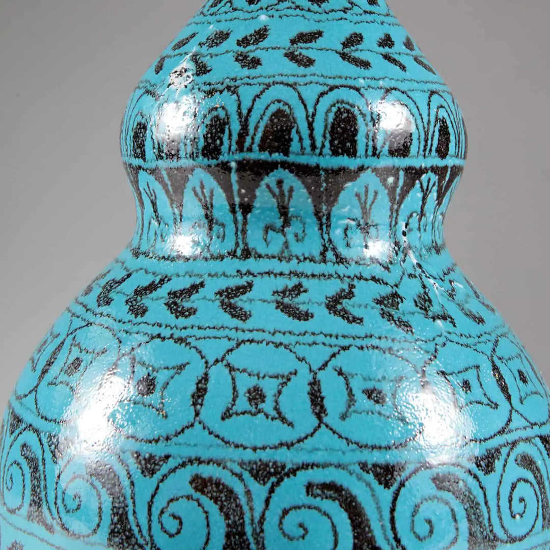 Turquoise Double Gourd Vase showing intricate black patterns on a glossy blue ceramic surface, made in Italy table lamp base.