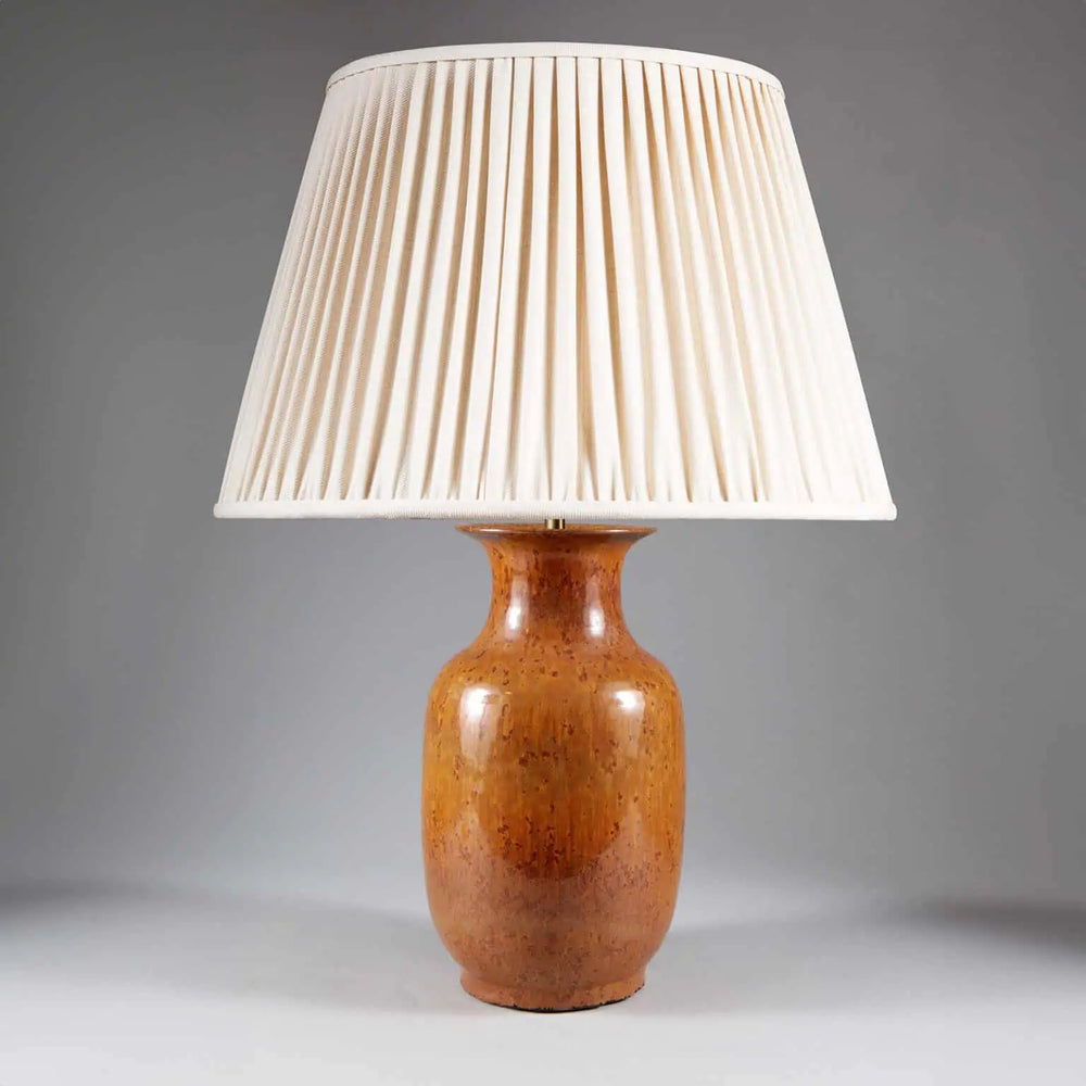 Monochrome Brown Glazed Lamp with a smooth brown ceramic base and pleated cream fabric shade, 33 cm tall.