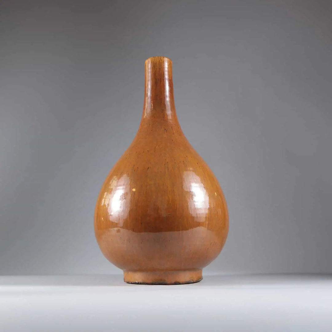 Tall Monochrome Vase Table Lamp in glazed brown porcelain with a smooth rounded shape and narrow neck.