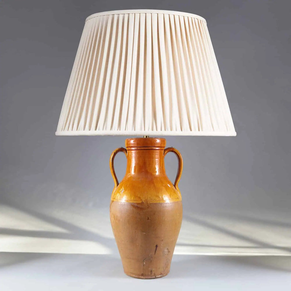 Yellow Umber Glazed Amphora Vase Mounted as a Table Lamp with classic amphora shape and two loop handles.