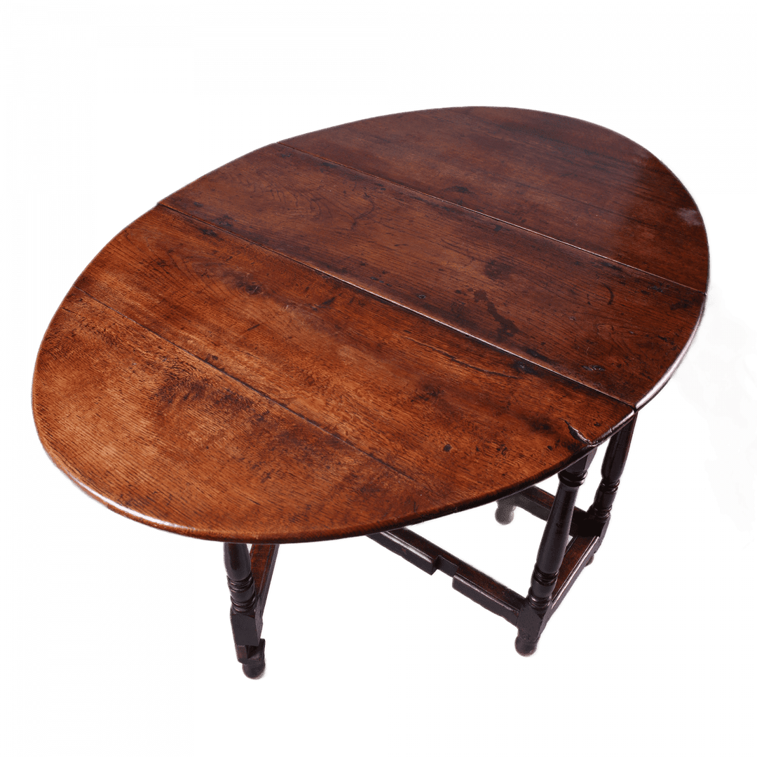 17th Century Oak drop leaf table with turned legs and stretchers, oval top in rich oak wood finish.