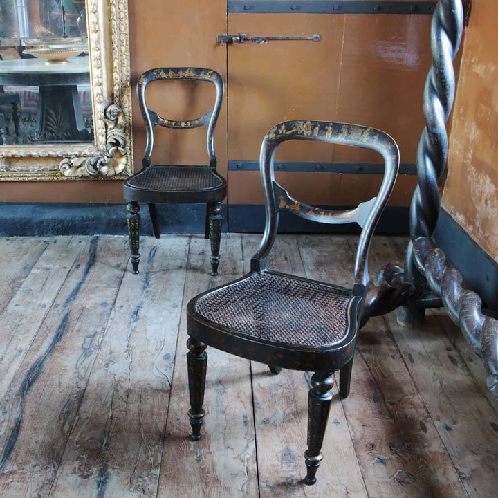 Pair of black japanned side chairs by Collection EE30 with elegant eighteenth-century British design and patina.