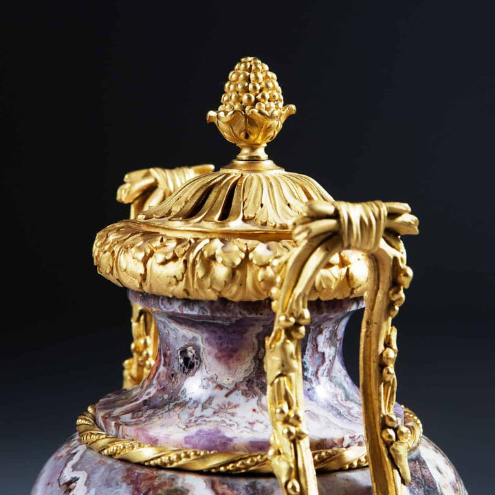 Close-up of ornate gilt bronze top on Siberian amethyst urn from Collection CK20, showcasing intricate craftsmanship.