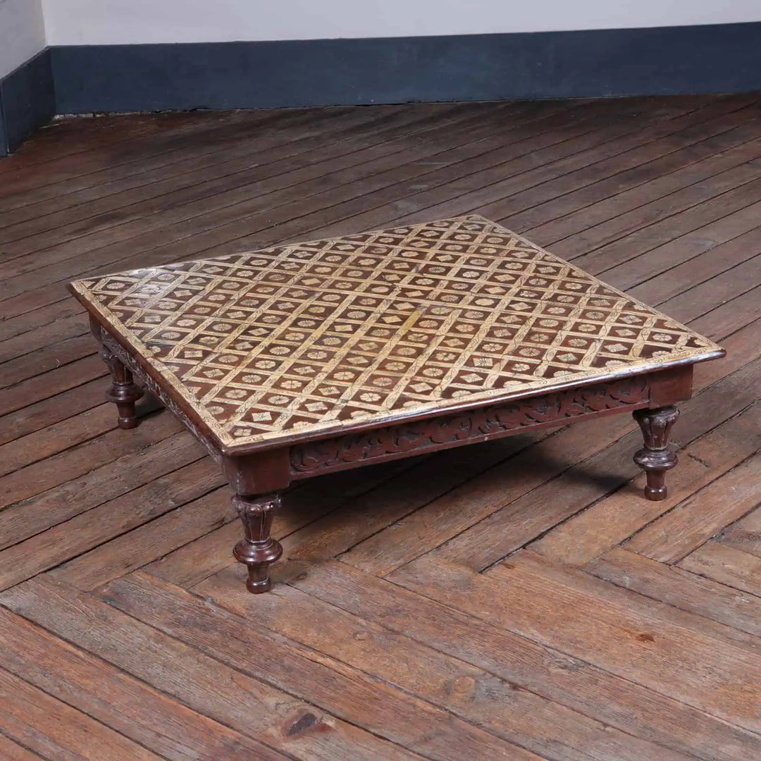 Antique Indian Bone Inlaid Low Table with engraved bone inlay, floral details, and carved wooden legs on wooden floor.