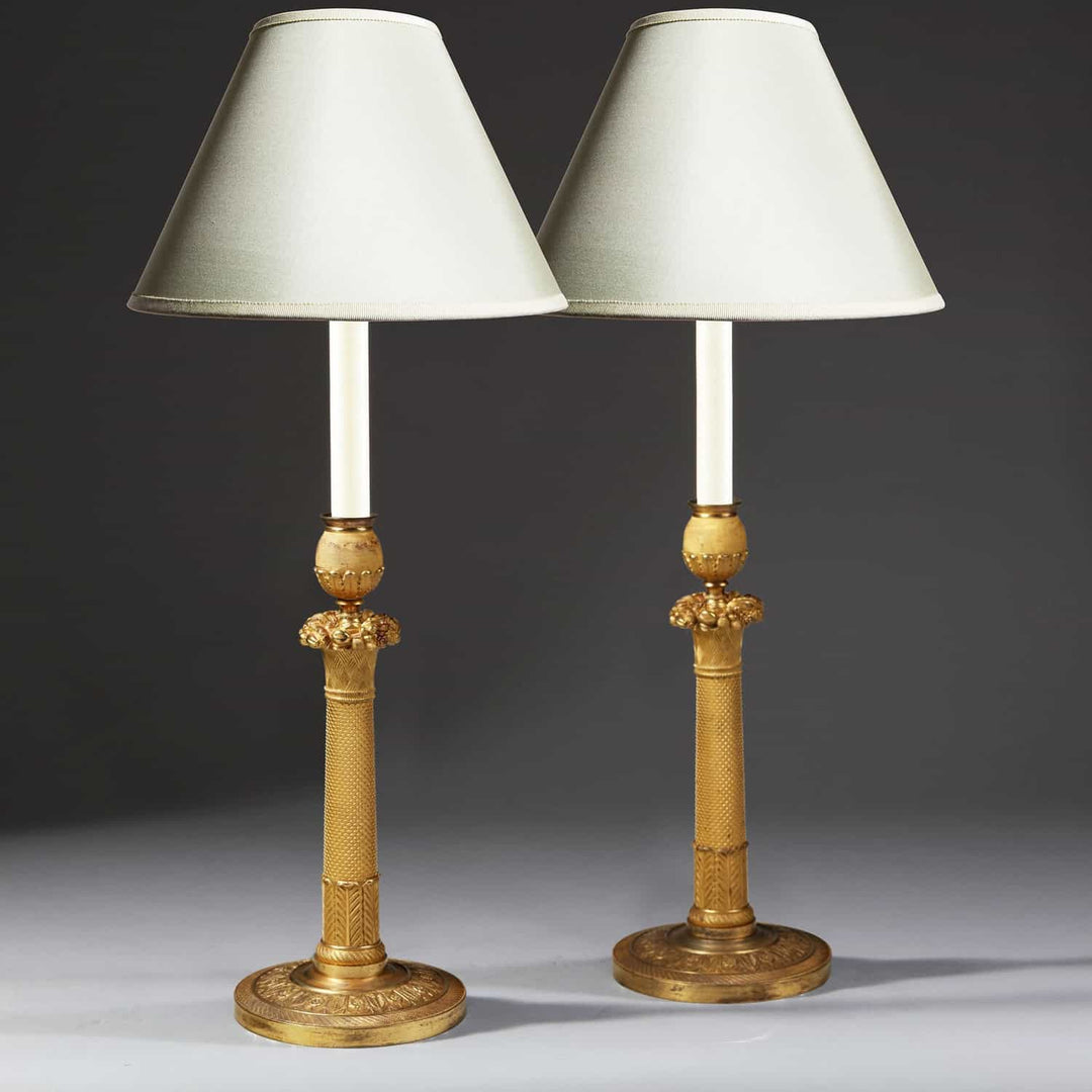 FRENCH EMPIRE GILT CANDLESTICK LAMPS