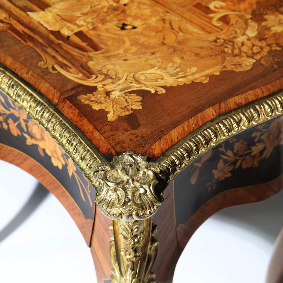 Exceptional 19th Century Marquetry Table with intricate floral marquetry and gilt bronze rococo mounts on curved cabriole legs.