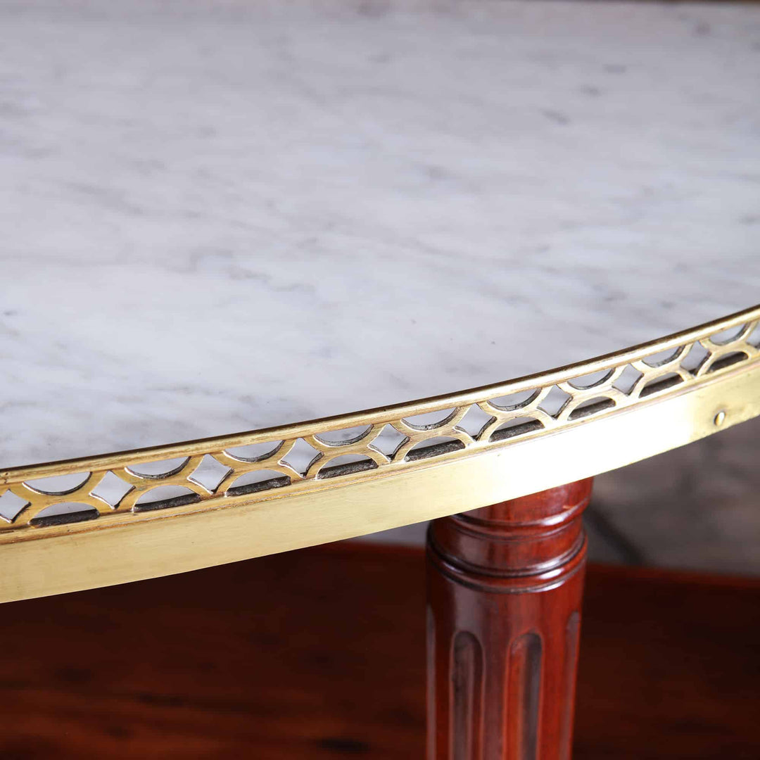 Louis XVI Style Acajou Moucheté Demi Lune Console Desserte with white marble top and brass rail detailing.