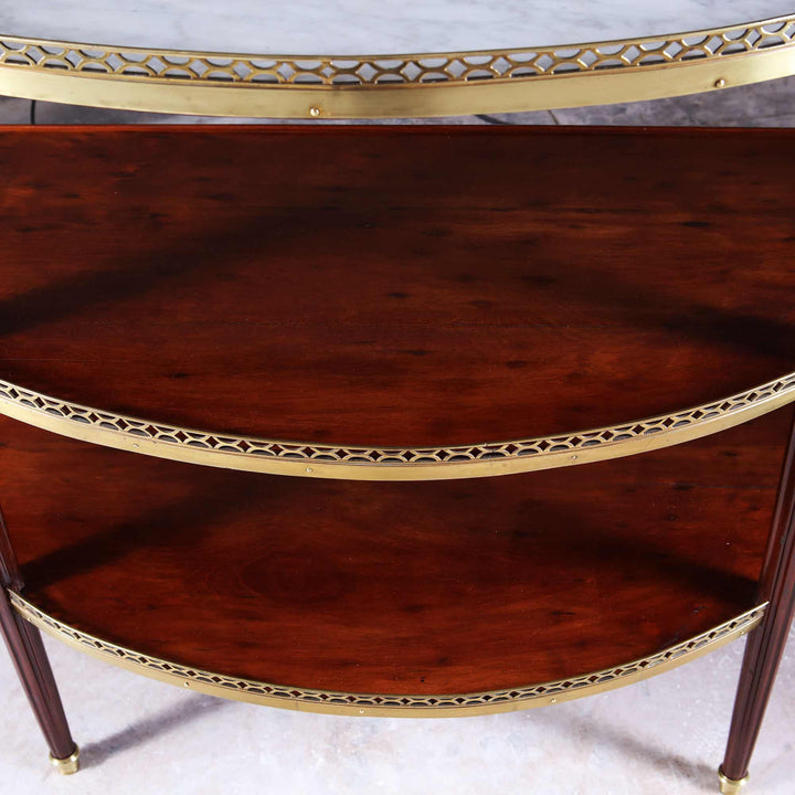 Louis XVI Style Acajou Moucheté Demi Lune Console Desserte with brass rails and plum pudding mahogany tiers.