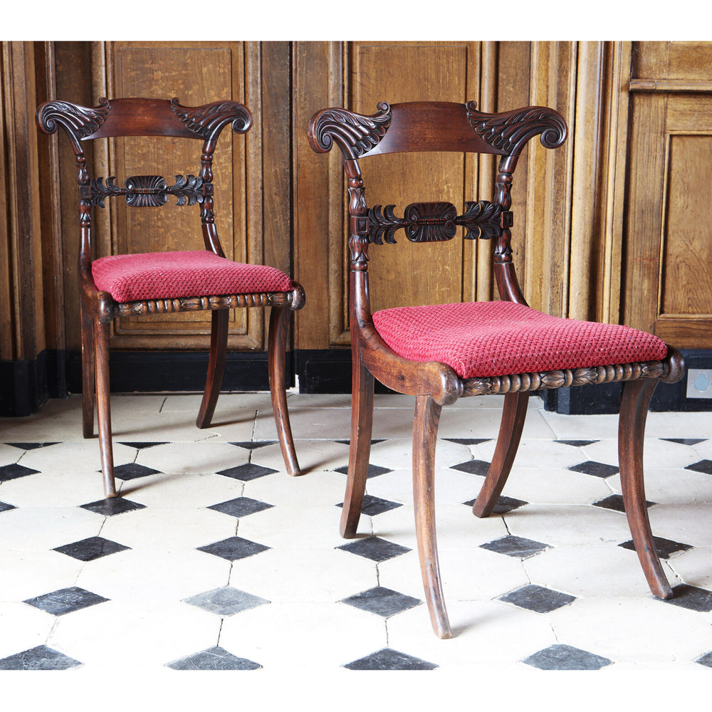 Pair of Regency side chairs with carved mahogany frames and red upholstered seats by Collection EE30.