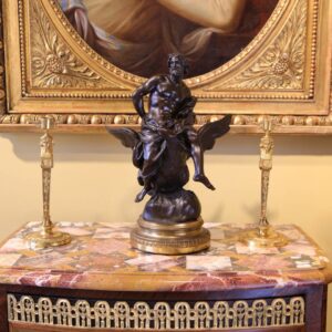 Pair Of Neo Egyptian Empire Gilt Bronze Candlesticks with female caryatid figures and lion mask handles circa 1820.