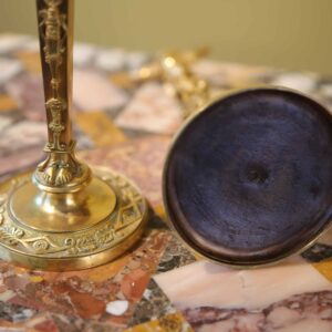 Pair Of Neo Egyptian Empire Gilt Bronze Candlesticks with caryatid figures and lion mask nozzles, circa 1820, France.