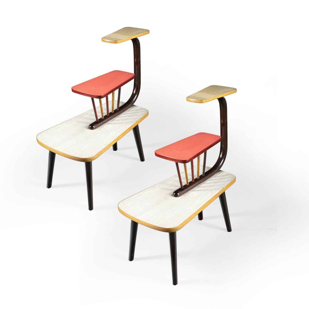 Pair of mid century three tier end tables with bent wood and polychrome Formica tiers on turned tapering legs.