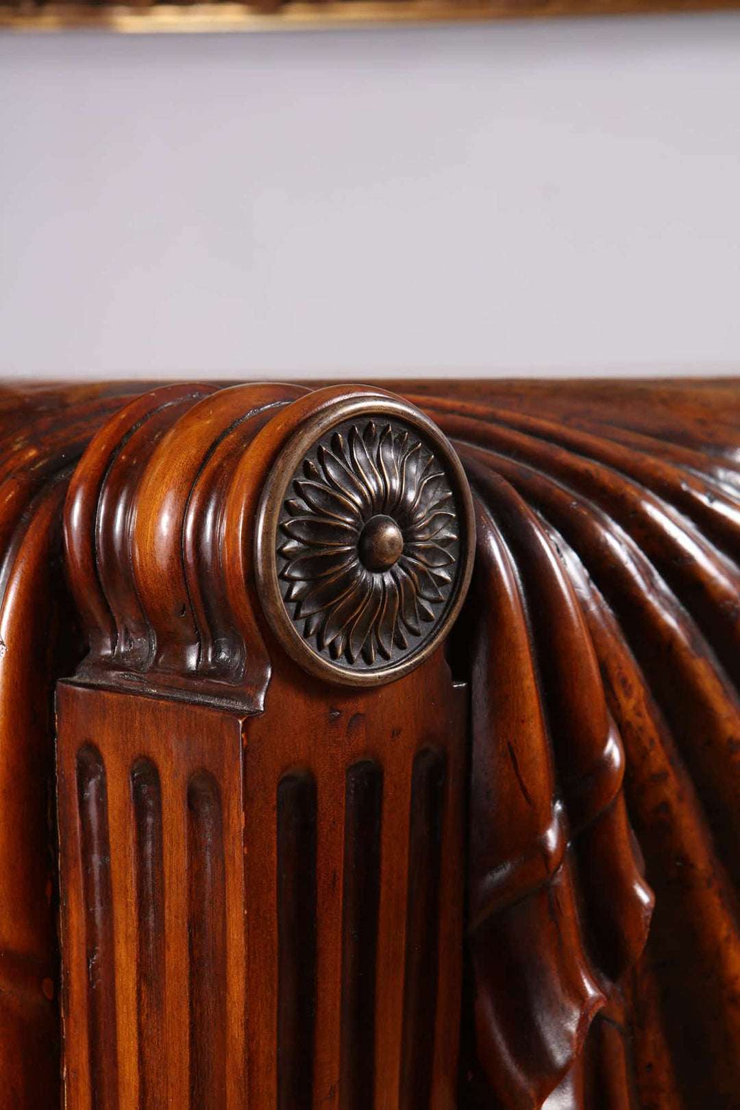 Centre Table after a Design By Charles Heathcote Tatham showing detailed carved wooden corner with floral motif.