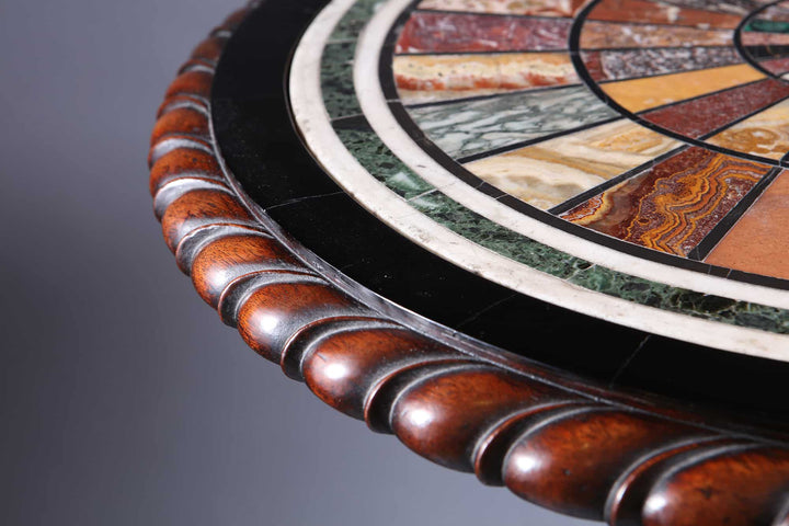 Regency Specimen Marble Centre Table with intricate multi-colored marble inlay and carved wooden edge, circa 1820.