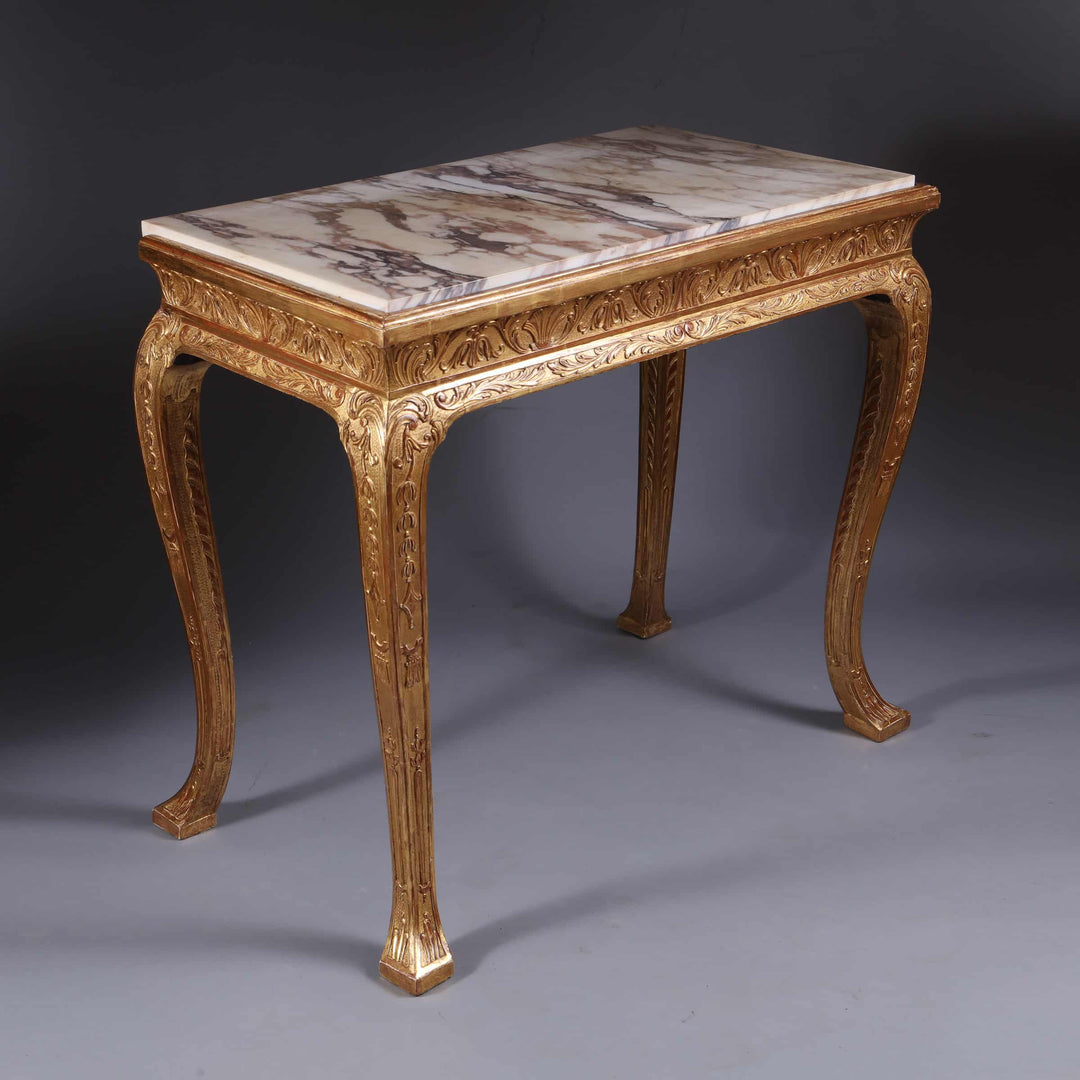 George I Gilt Gesso Side Table with marble top, intricate carvings, and gilt accents, 19th century English design.