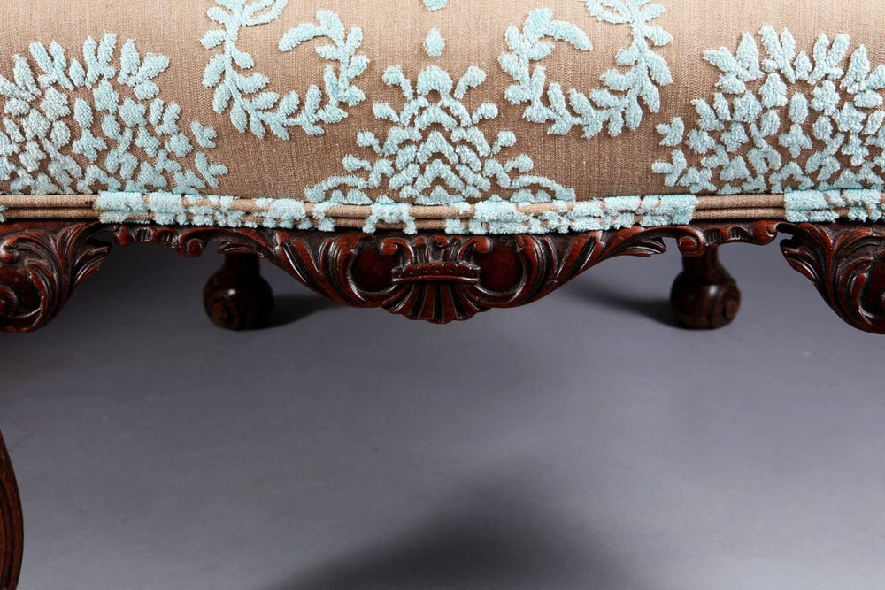 Close-up of intricately carved mahogany leg and upholstery on George II style side chair by Collection CK20