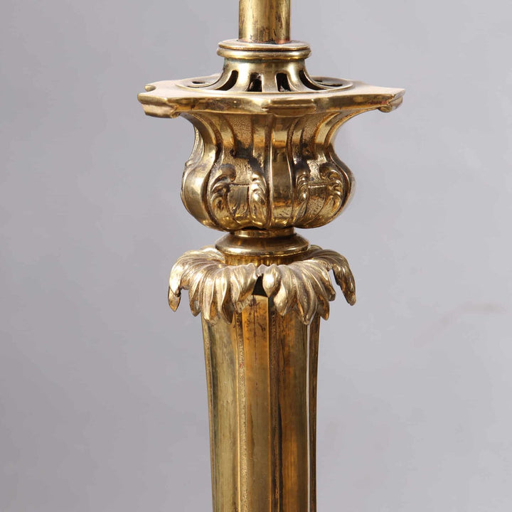 Pair of Brass Column Lamps featuring ornate vintage design with intricate leaf and scroll detailing on a polished brass base.