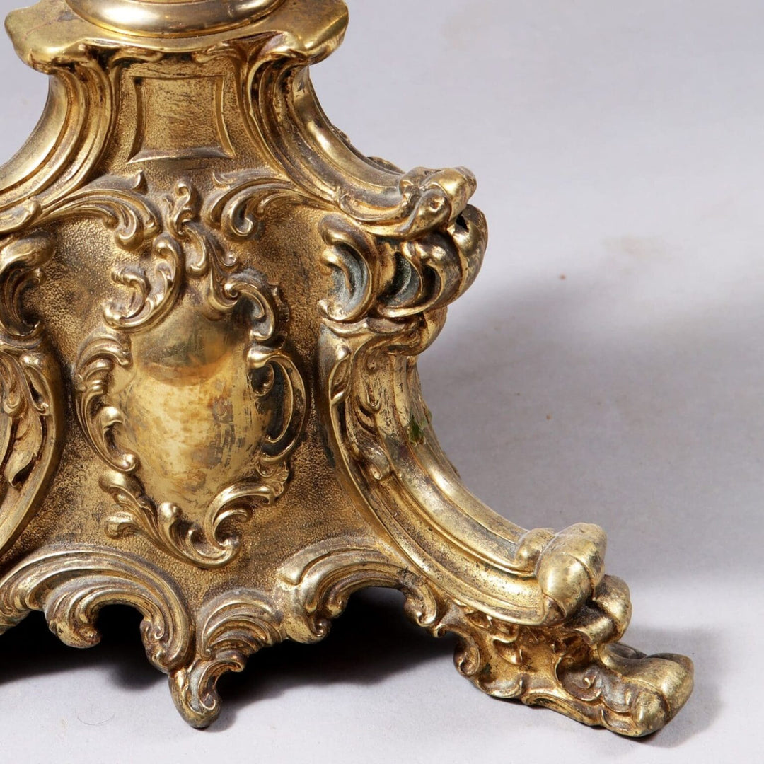 Close-up of ornate brass base detail on a Pair of Brass Column Lamps showcasing intricate vintage design.