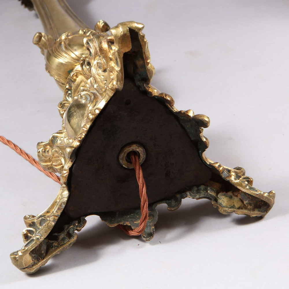 Pair of Brass Column Lamps with ornate bases and exposed wiring detail viewed from the bottom side angle.
