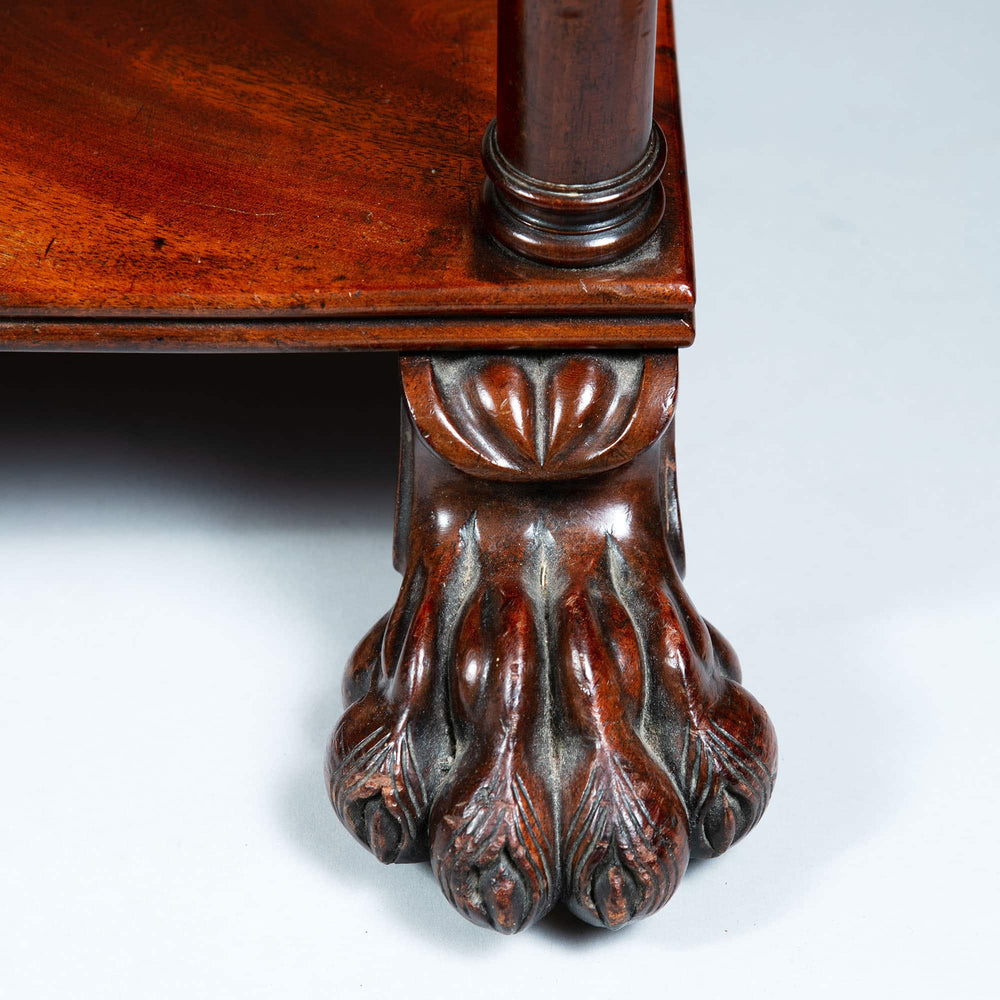 Close-up of carved sunken paw foot in polished flame mahogany on shelves by Collection CK20 Regency style
