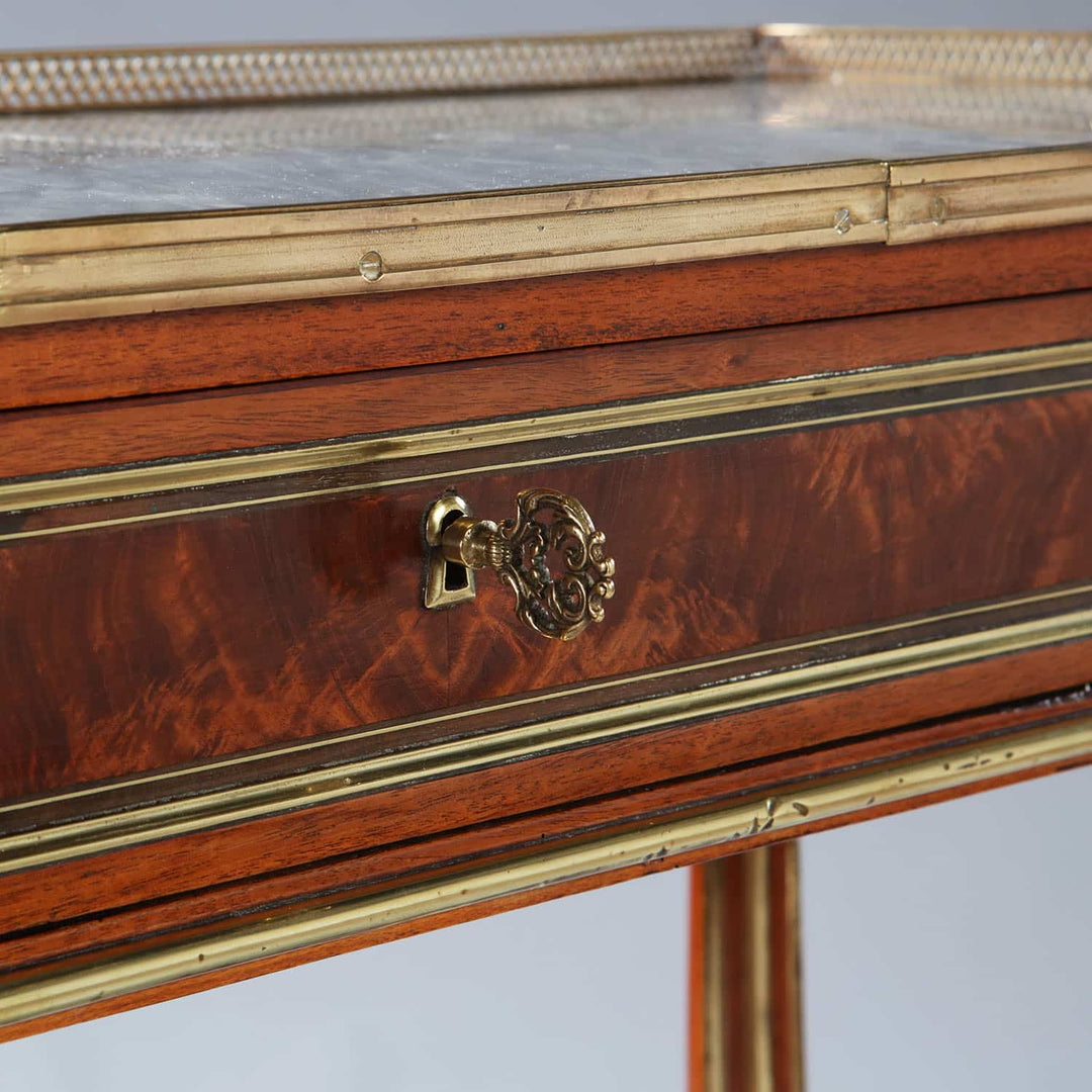 Late 18th century Louis XVI French Console Dessert with brass gallery, flame mahogany drawer, and brass details.