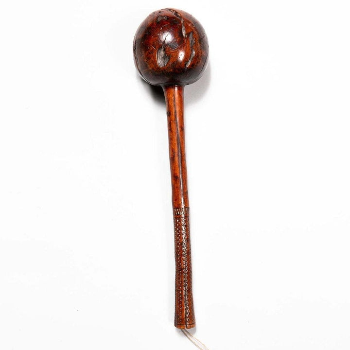 Fijian Throwing Club with round bulbous head and carved handle featuring parallel tava tava lines, circa 1850.