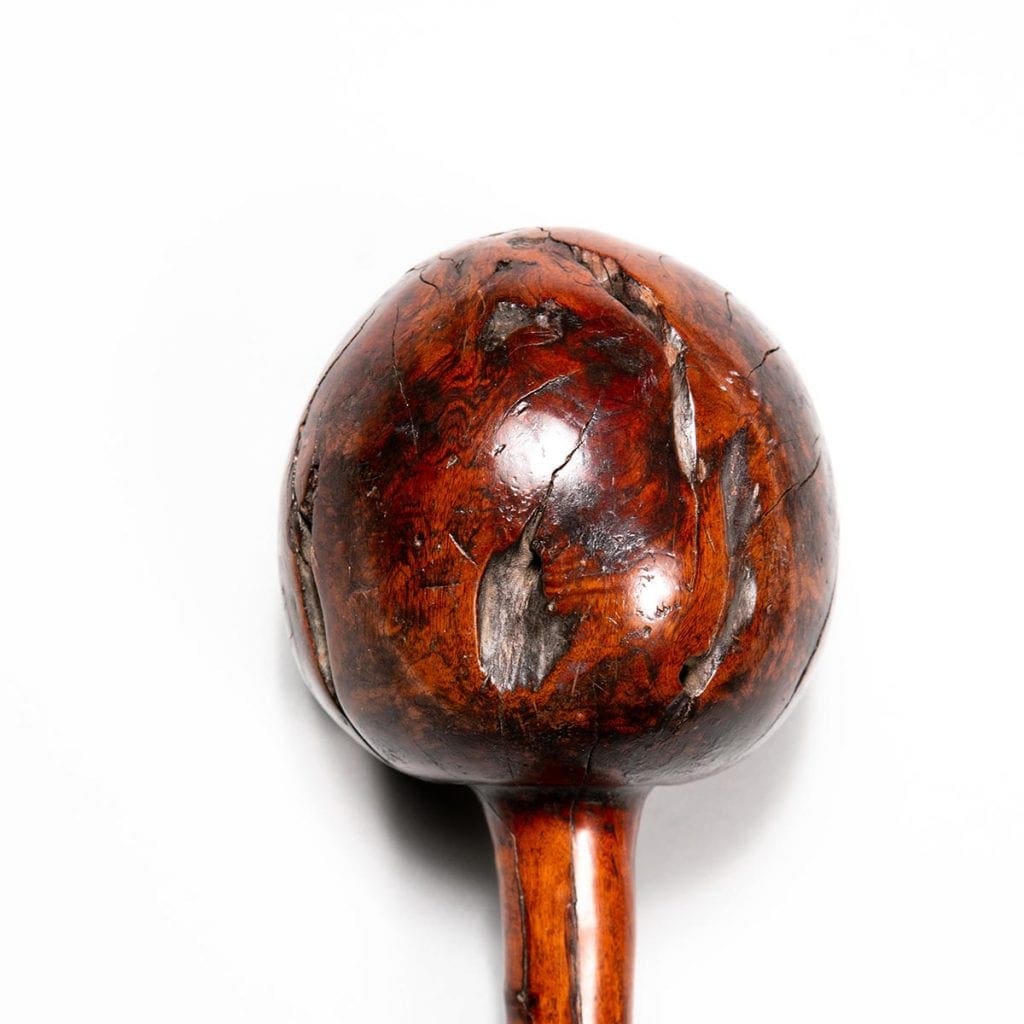 Fijian Throwing Club with round bulbous head and natural inclusions, polished wood, circa 1850, diameter 9 cm, height 42 cm