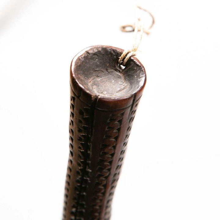 Fijian Throwing Club with round bulbous head and carved handle featuring parallel tava tava lines, circa 1850.