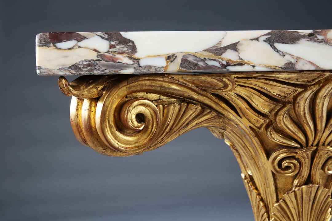 Pair of Antique Neo Classical Giltwood and Marble Monopedia Console Tables with ornate carved giltwood detail and marble top