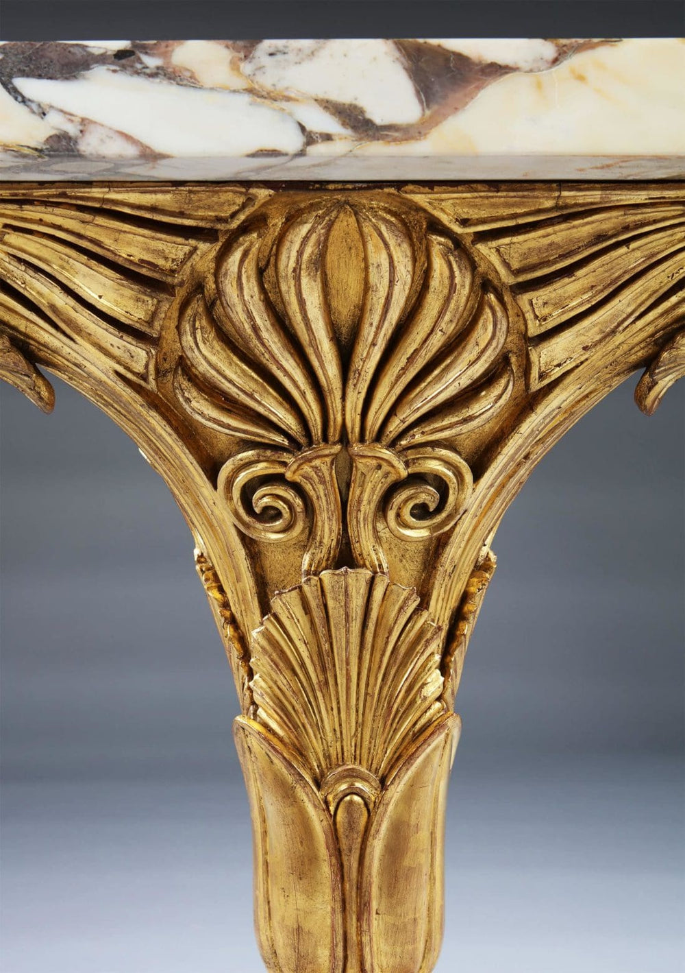 Pair of Antique Neo Classical Giltwood and Marble Monopedia Console Tables with intricate carved giltwood detail and marble top