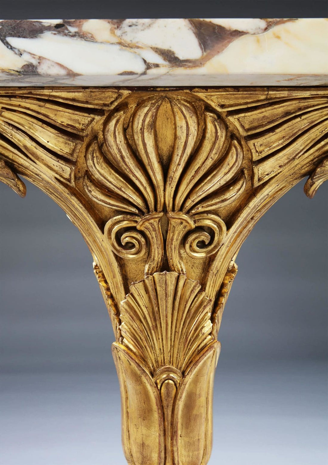 Pair of Antique Neo Classical Giltwood and Marble Monopedia Console Tables with intricate carved giltwood detail and marble top