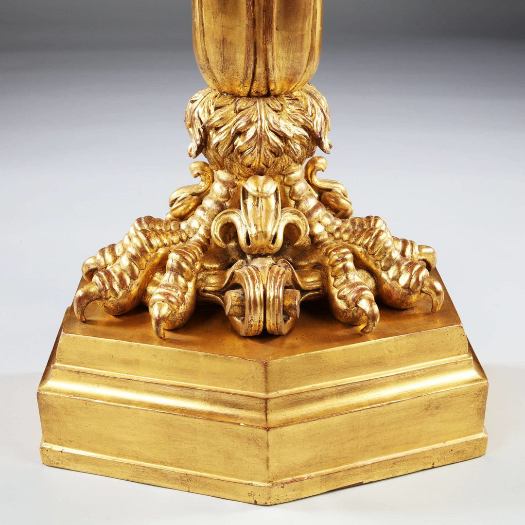 Close-up of gilded claw foot detail on a Pair of Antique Neo Classical Giltwood and Marble Monopedia Console Tables