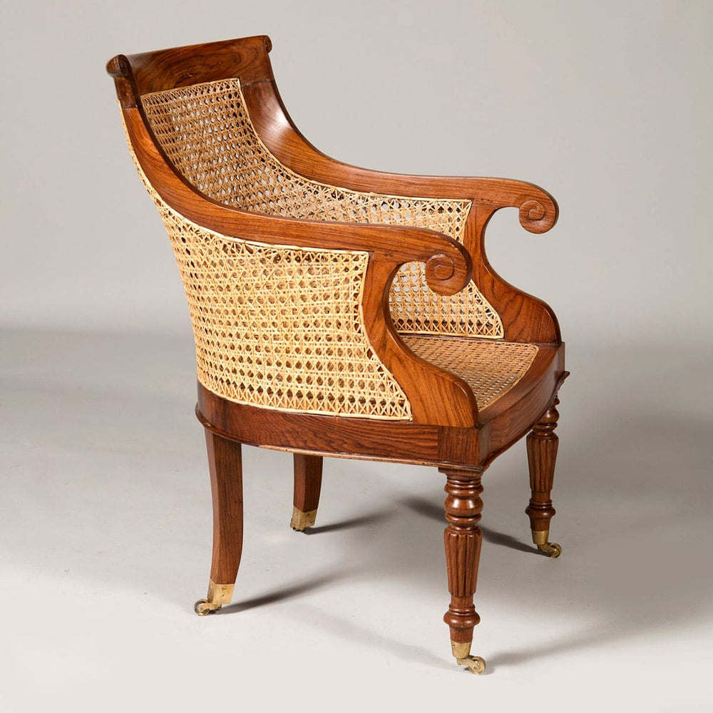 Pair of Regency style caned library chairs with brass castors and turned legs by Collection EE30