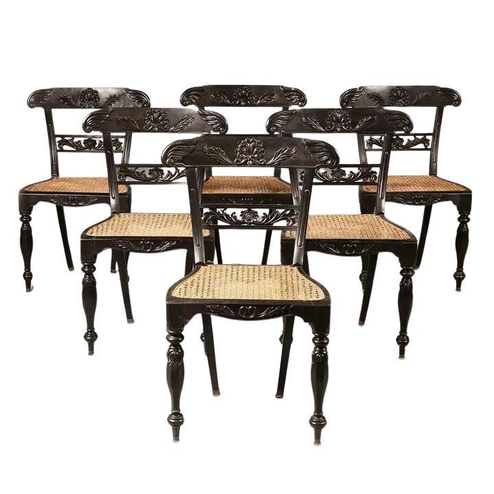 Set of six Anglo Indian ebony side chairs with caned seats and carved details by Collection EE30