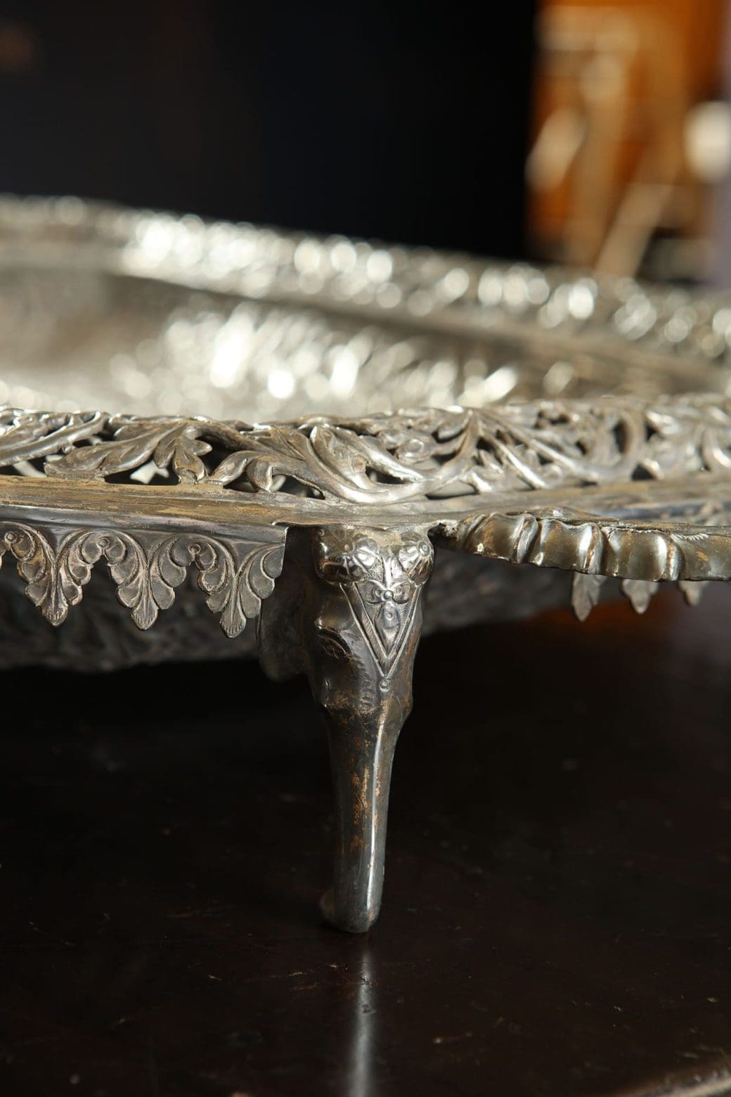 Close-up of ornate leg and edge of large Indian Rajasthani silver pierced and repoussé tray by Collection EE20