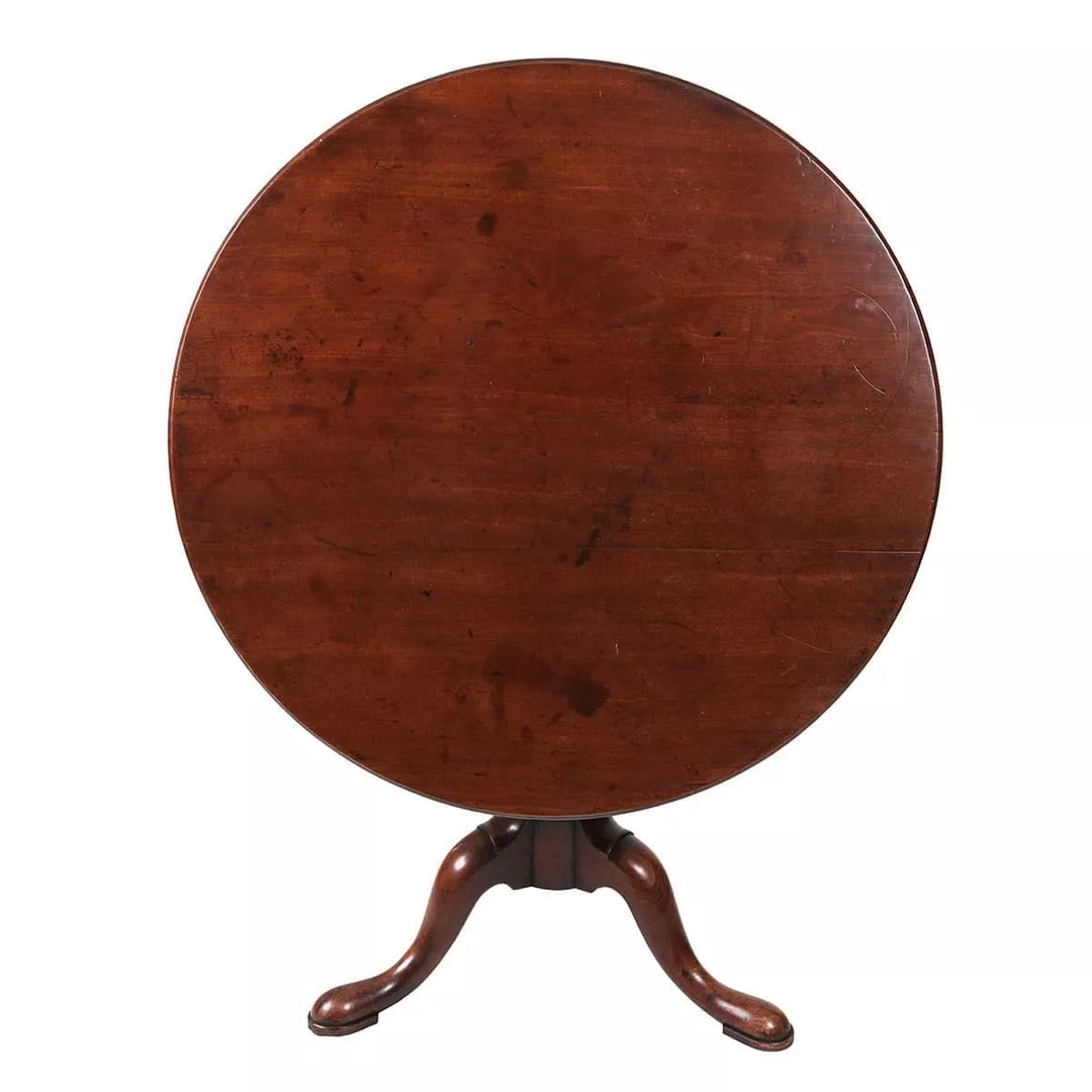 Georgian Mahogany Circular Tilt Top Tripod Table with turned column and three out-swept cabriole legs circa 1735.