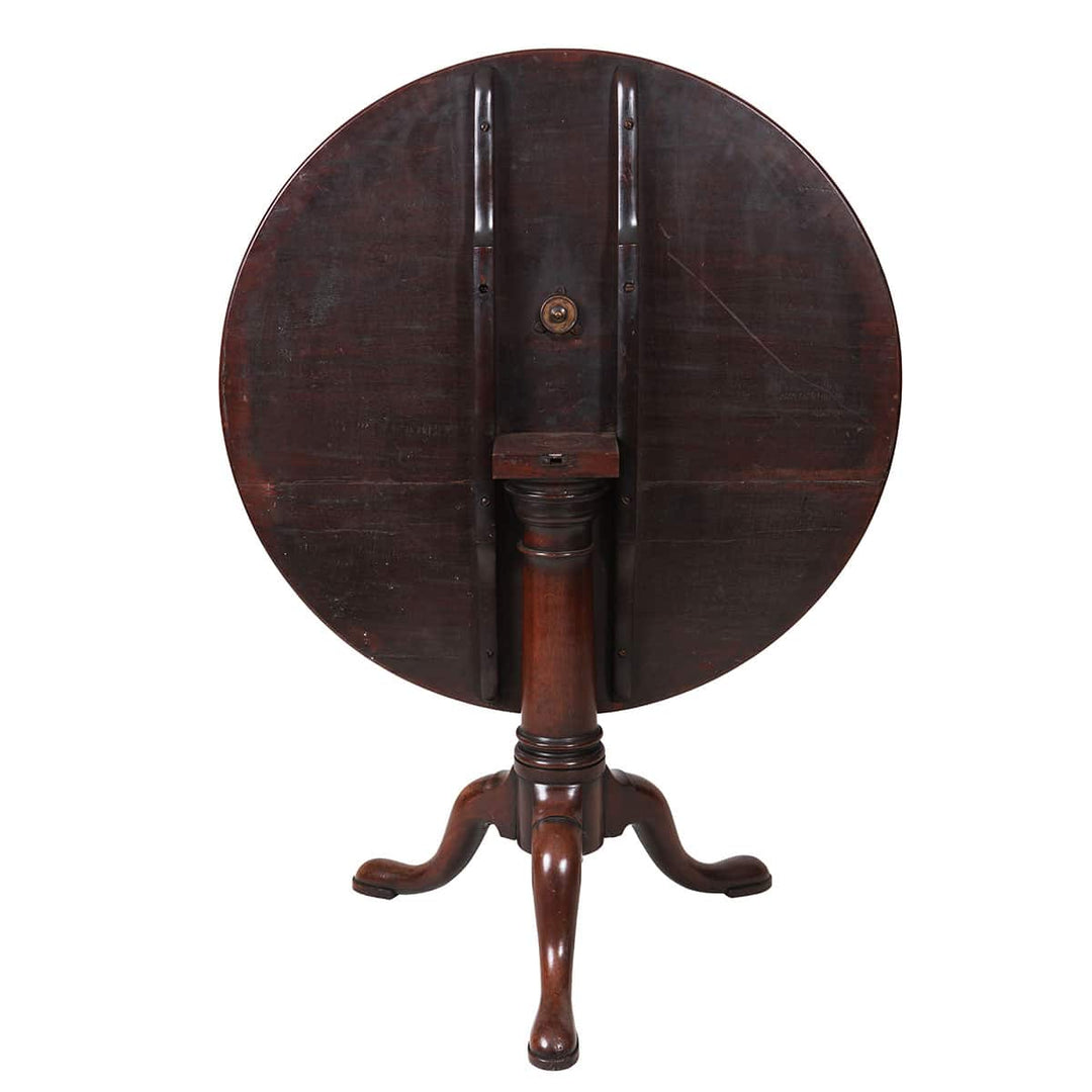 Georgian Mahogany Circular Tilt Top Tripod Table showing turned column base and three cabriole legs with pad feet.
