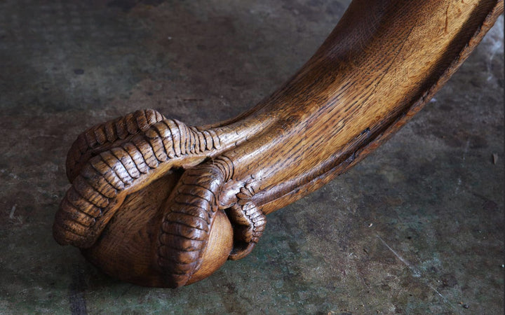 Gillows Extending Quarter Sawn Oak Circular Dining Table with detailed carved ball and claw feet on oak base.