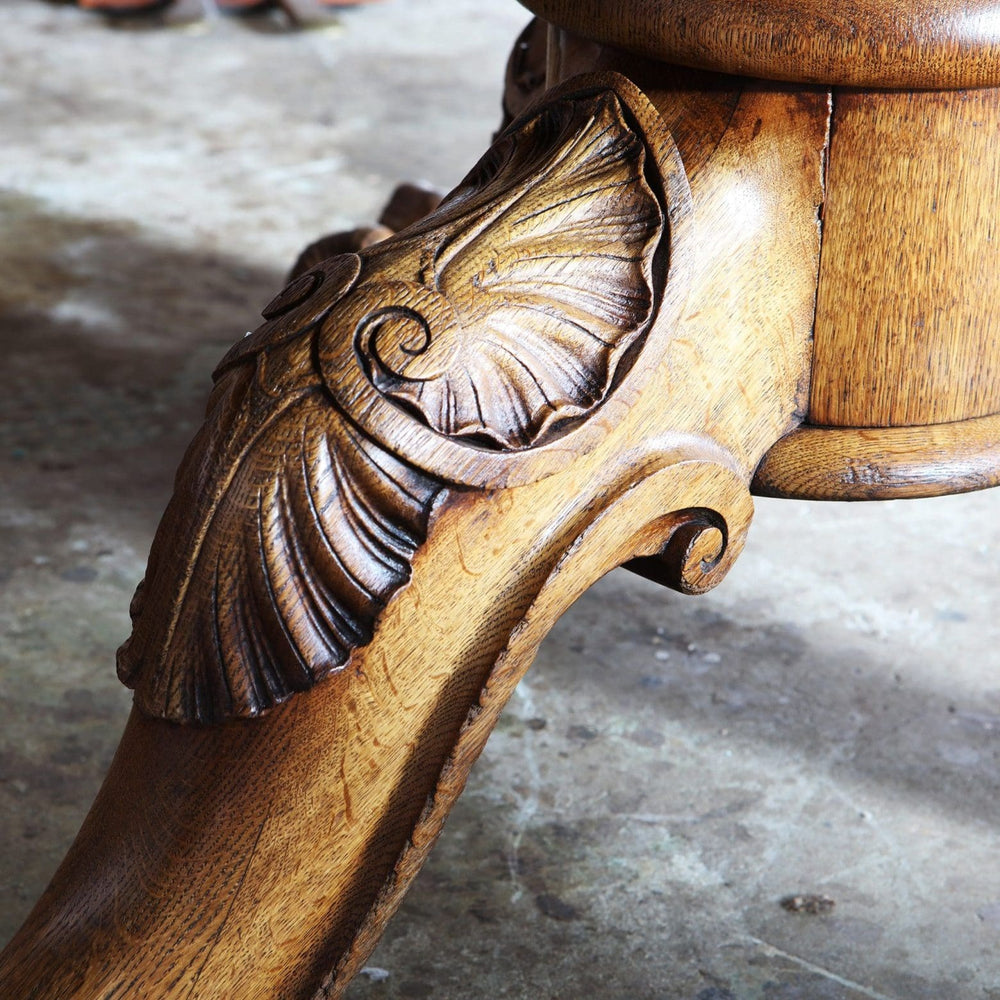 Gillows Extending Quarter Sawn Oak Circular Dining Table carved ball and claw foot detail in oak finish.