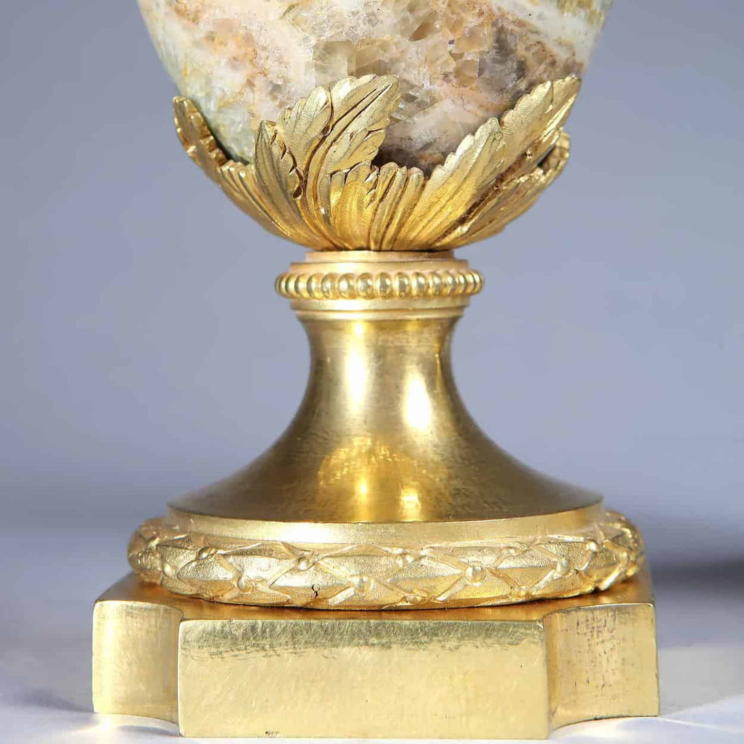 Close-up of gilt bronze base with ornate leaf and vine details on Weardale Fluorspar urn by Nicholas Wells Antiques