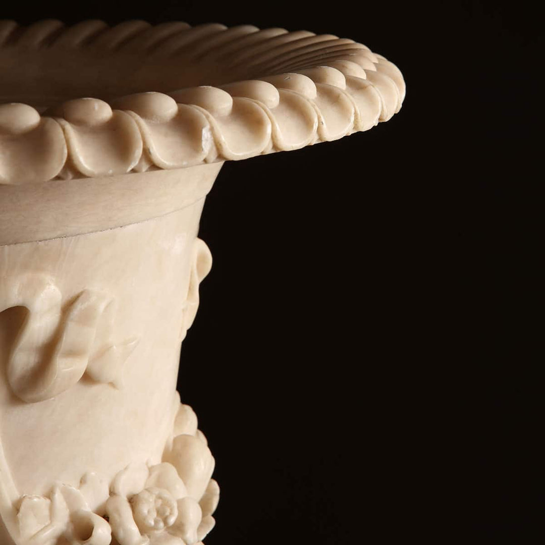 Close-up of finely carved alabaster vase rim with floral and classical motifs by Collection CK20
