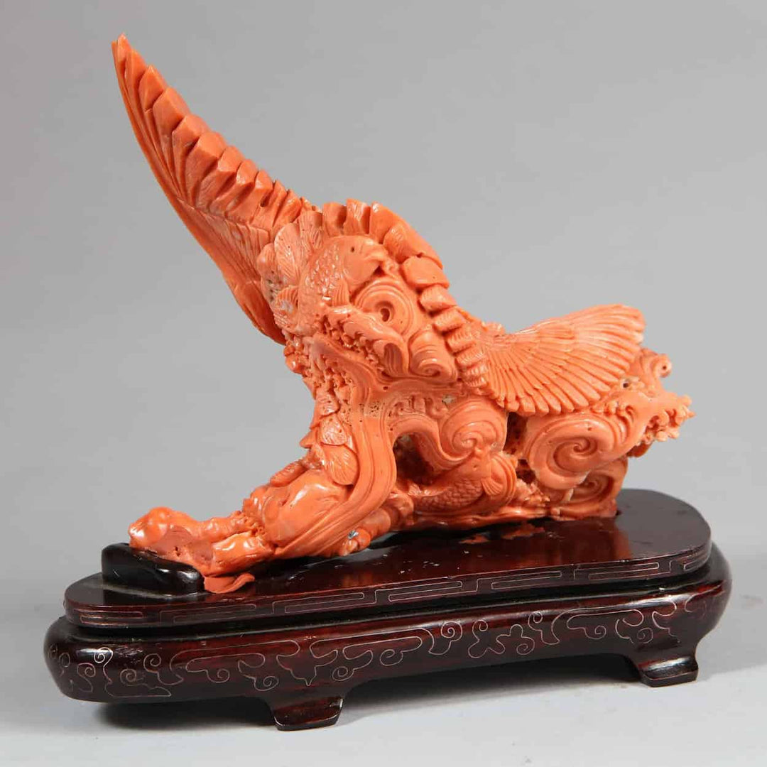 Japanese carved coral sculpture of a Stellar’s Sea Eagle catching a fish by Nicholas Wells Antiques