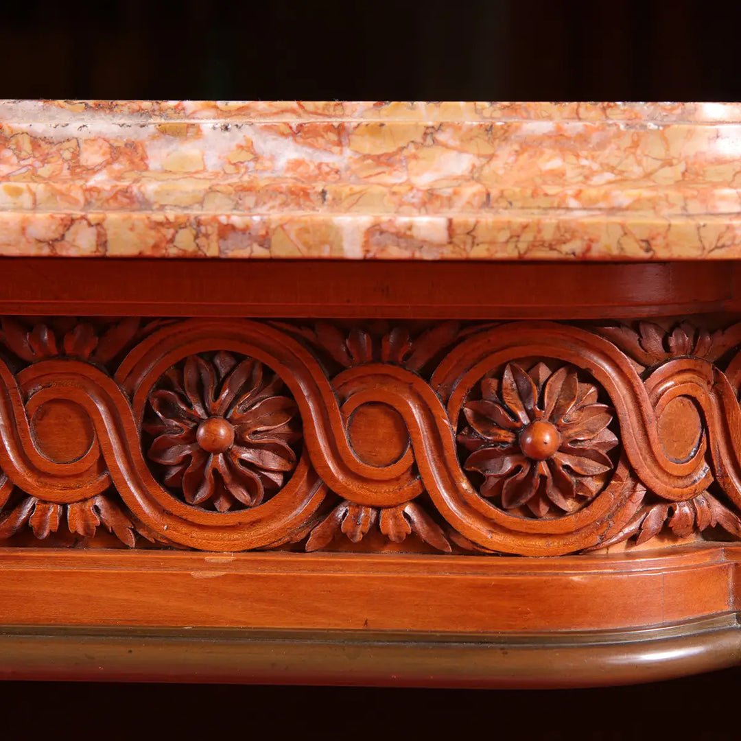Close-up of carved floral frieze and marble top on Georges Jacob Satinwood Side Table circa 1790.