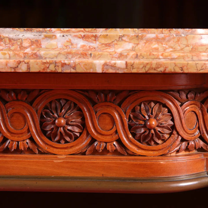 Close-up of carved floral frieze and marble top on Georges Jacob Satinwood Side Table circa 1790.