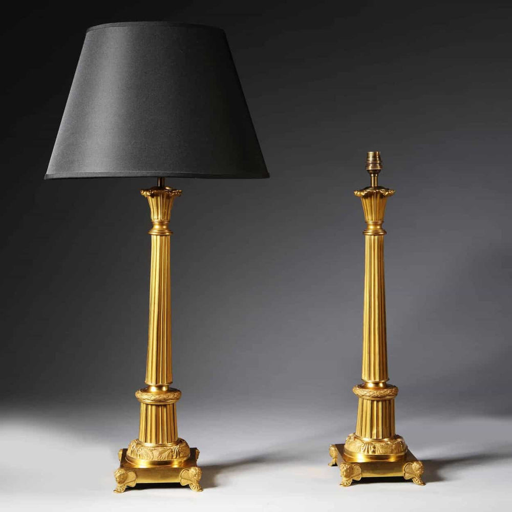 Pair Of French Gilt Bronze And Tole Antique Gold Column Table Lamps with black shade, Art Deco style circa 1930 France.