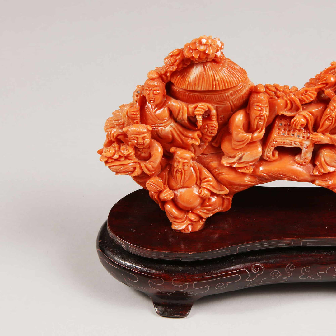 Chinese 20th century carved precious coral group showing figures relaxing, offered by Nicholas Wells Antiques.