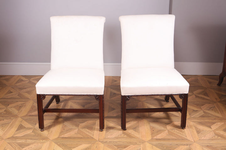 Pair of George III mahogany side chairs with white upholstery and original leather casters from Collection CK20