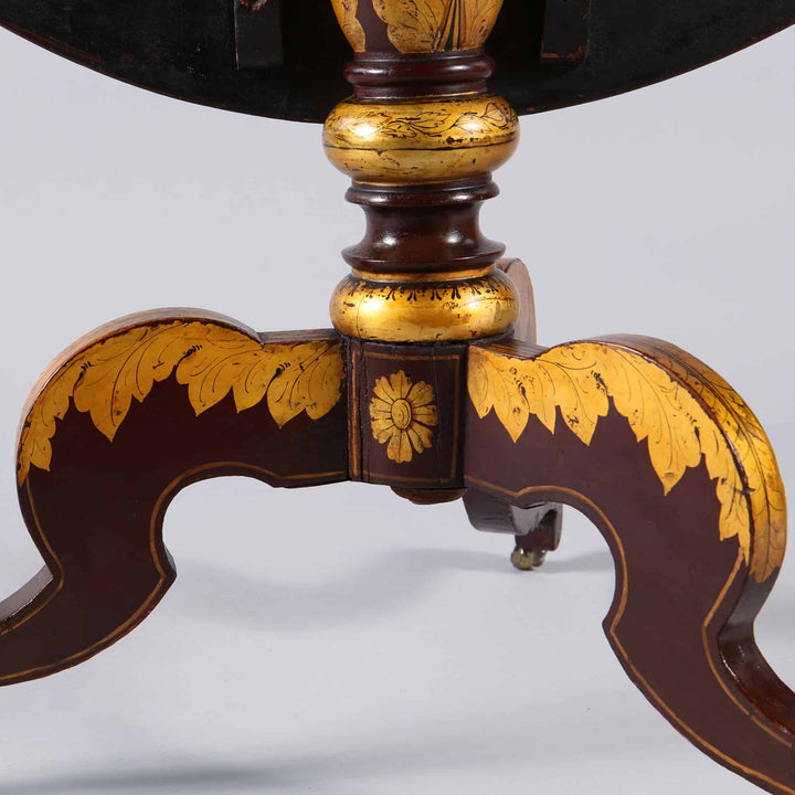 Japanned Tilt Top Occasional Table tripod base with gilt foliate ornament and casters in antique style.