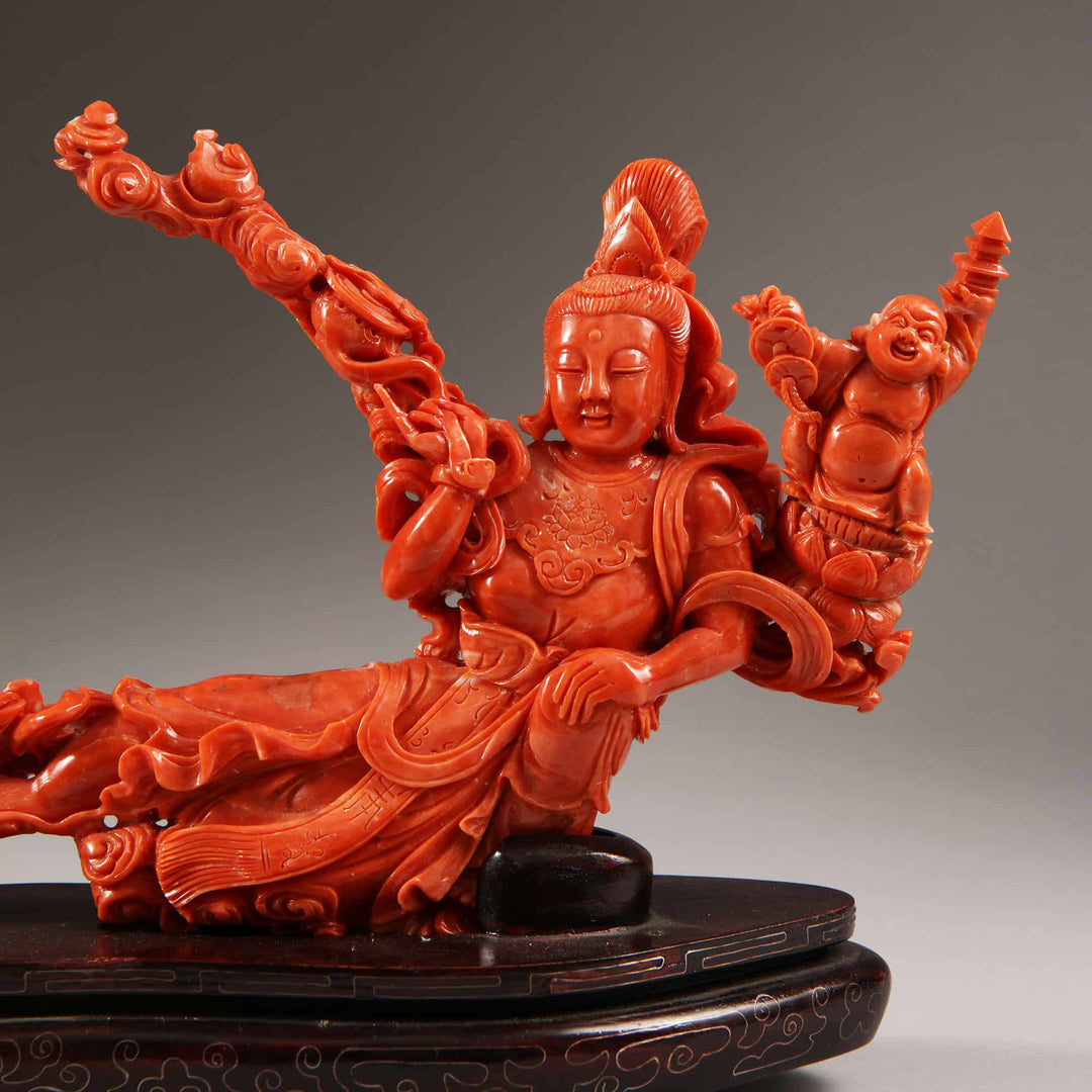 Chinese carved precious coral reclining Guanyin figure with attendants by Nicholas Wells Antiques circa 1900
