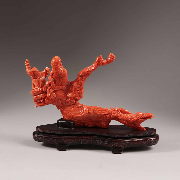 Chinese carved precious coral reclining Guanyin figure with attendants on carved wooden base by Nicholas Wells Antiques